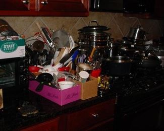 Boxes and boxes of pots and pans, kitchen tools and more