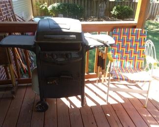 Gas grill and webbed river chair 
