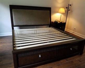 Benchcraft King size upholstered headboard bed with storage drawers at the end of bed.  Also, selling two matching nightstands and dresser. 