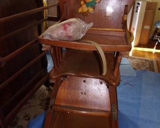 Vintage wooden baby high chair.