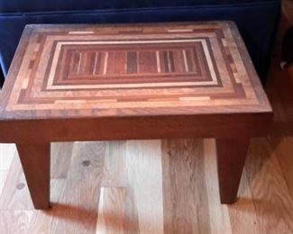 Sturdy wood inlay stool.