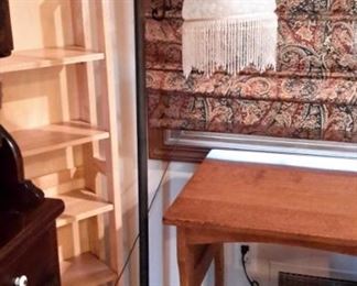 Very nice vintage student desk with 4 drawers. Vintage-look floor lamp and modern blonde wood shelving.