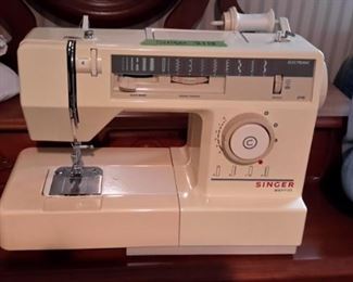 Singer commercial sewing machine, with rolling case.