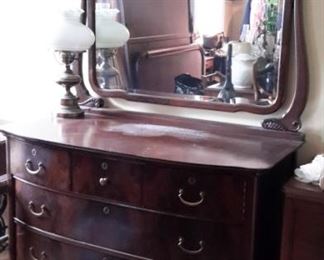Lovely antique dresser with swivel mirror. Top of dresser needs repair due to water damage...priced to sell!