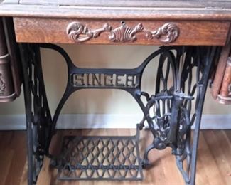 Antique Singer sewing machine and cabinet.