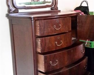 Antique dresser with swivel mirror.