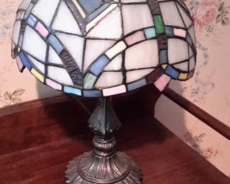 Tiffany style lamp with heavy brass base.