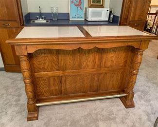 FREE STANDING BAR WITH BRASS FOOT RAIL, MARBLE INLAID TOP AND LOTS OF STORAGE ON BACK SIDE. STOOLS IN NEXT PIC WOULD LOOK GREAT TOGETHER