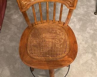 TWO PRESS WOOD CANE SEATED BISTRO STOOLS.