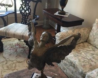 Bronze statue.   Rosewood game table Pair of Chippendale style are chairs.   Lamp not available.