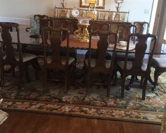 Kittinger triple pedestal dining table with two 24" leaves.   Opens to 12'   includes 12 Kittinger chairs...Also table pads  Quite a find for $2800....