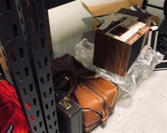leather carry on bag,pair of Bose speakers
