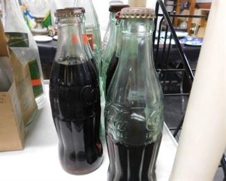 Assorted Coca Cola bottles 
