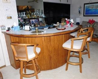 four cane and wood bar stools