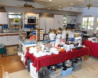 kitchen packed with cookware, kitchen gadgets, cook books, small appliances, pots and pans