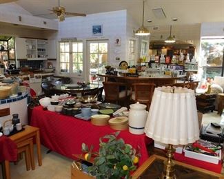 kitchen packed with cookware, kitchen gadgets, cook books, pots and pans