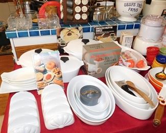 kitchen packed with cookware, kitchen gadgets, cook books, small appliances, pots and pans