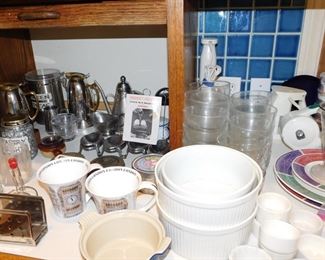 kitchen packed with cookware, kitchen gadgets, cook books, small appliances, pots and pans