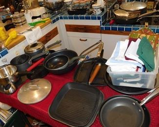 kitchen packed with cookware, kitchen gadgets, cook books, small appliances, pots and pans