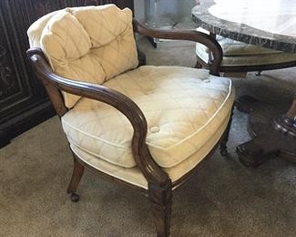 Four rolling chairs with plush upholstery