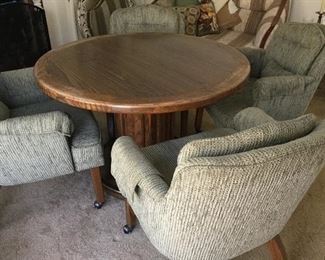 Game table with four rolling chairs