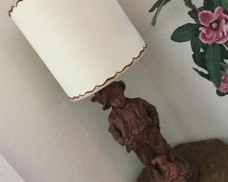 Huge lamp, boy with dog