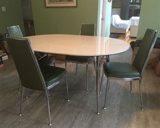 Fabulous "Chromatic 66" Mid Century Formica and heavy chrome chairs with olive green vinyl.  Wonderful! It's like eating your Cheerios in 1968!  