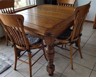 English Oak draw leaf table and 4 chairs. There are actually 3 of these tables, all matching