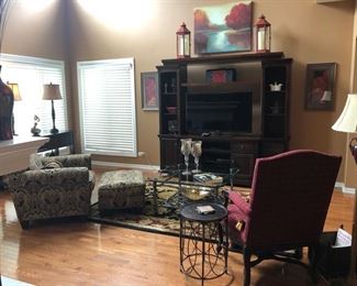 Here's the Great Room - with the Flexsteel chair and ottoman on the left, the 3-pc. media unit and the 46" Samsung HDTV,  Great Nourison Rug, Coffee Table, prints and original art  on the walls, lamps, tables and the Drexel-Heritage chair to the right.  