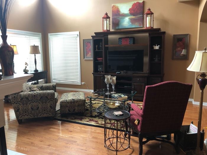 Here's the Great Room - with the Flexsteel chair and ottoman on the left, the 3-pc. media unit and the 46" Samsung HDTV,  Great Nourison Rug, Coffee Table, prints and original art  on the walls, lamps, tables and the Drexel-Heritage chair to the right.  