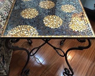 This is a very sweet mosaic table