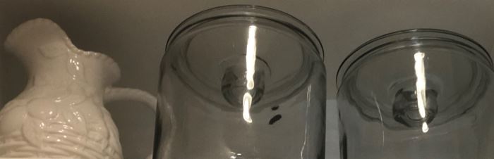 2 glass canisters and a pitcher