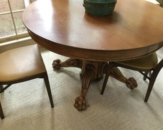 Antique circular ball and claw table.