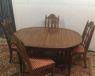 cherry table with extra leaf and 6 chairs