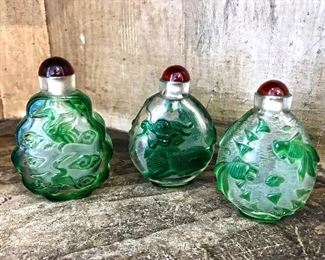 Clear snuff bottles with green overlay and red top. $50 each