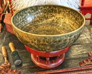 Large 13 inch beautifully carved brass bowl (singing bowl) on red lacquered pedestal. $600