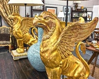 An early 20th century impressive pair of Swedish gilt Gryffons on painted and gilt pedestals. Old European fittings for electricity still in place as these statues were used as lamp bases. 2' 3" tall without lamp shades. Originally purchased for $14,500 ($7,250 each). Estate sale price $3,500 each.