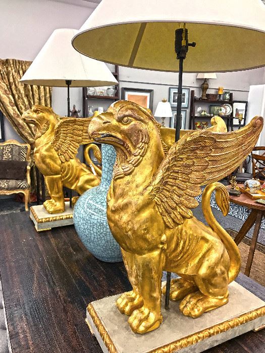 An early 20th century impressive pair of Swedish gilt Gryffons on painted and gilt pedestals. Old European fittings for electricity still in place as these statues were used as lamp bases. 2' 3" tall without lamp shades. Originally purchased for $14,500 ($7,250 each). Estate sale price $3,500 each.