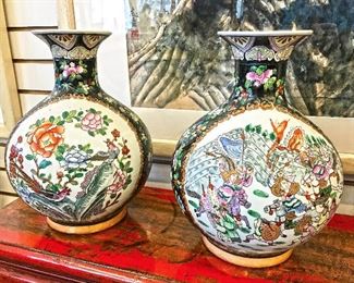 Pair of matching Chinese vases (12" tall) with a war scene on one side and floral design scene on the other. Set for $200.
