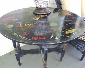 Cute hand painted table. 1/2 in French  the other Italian 