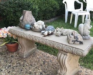 concrete bench and statues