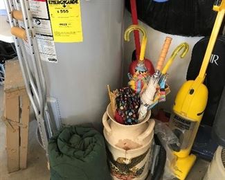 sleeping bag and vacuums and vintage decorative large vase