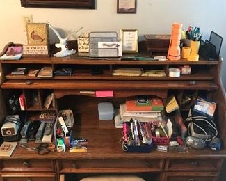 roll top desk with office supplies