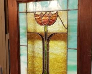 One of a pair of stained glass windows