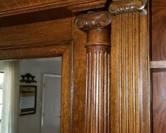 Pediments on fireplace and bookcases