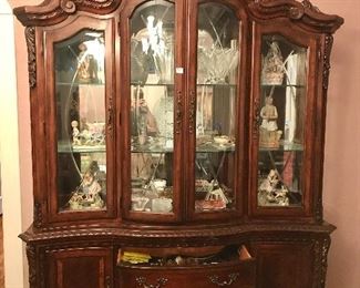 China cabinet, figurines and teacups inside