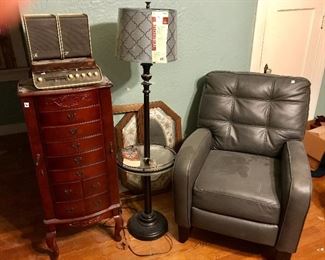 jewelry chest, tiny record player, and the other gray leather chair
