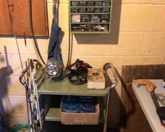 Metal rolling cart, vintage fishing rods, small drawers