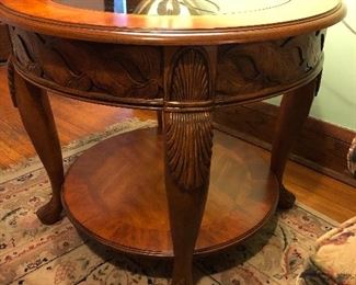 Carved wood side table with glass insert top