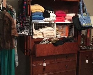 Armoire loaded with nice women's clothing